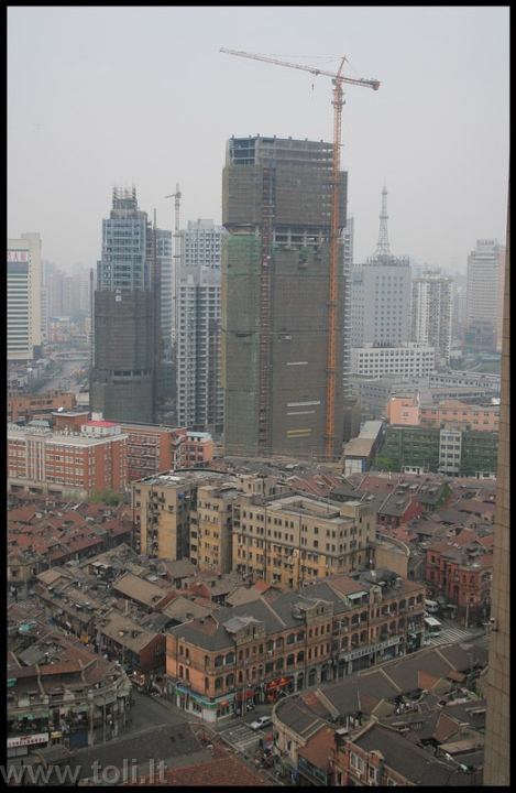 kinija01b Šanchajaus lūšnynų kvartalus keičia nauji daugiaaukščiai